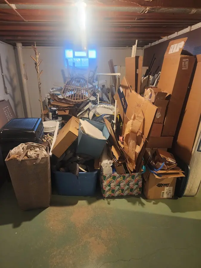 Roll-off dumpster container at job site for 15 Yard Dumpster Rental in Bern